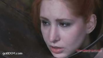 A redheaded slut sings the pleasure while vibrated